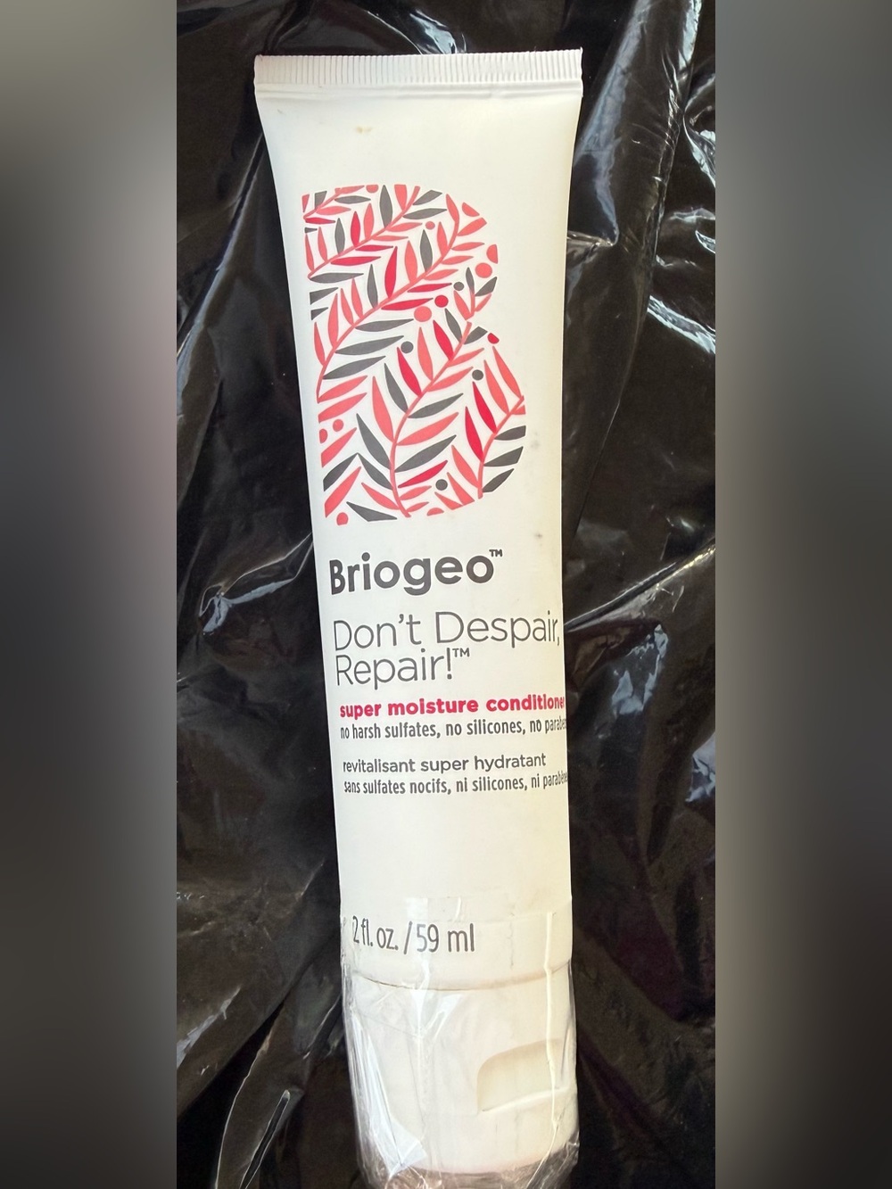 Briogeo White Tube with Pink and Gray Leaf Design